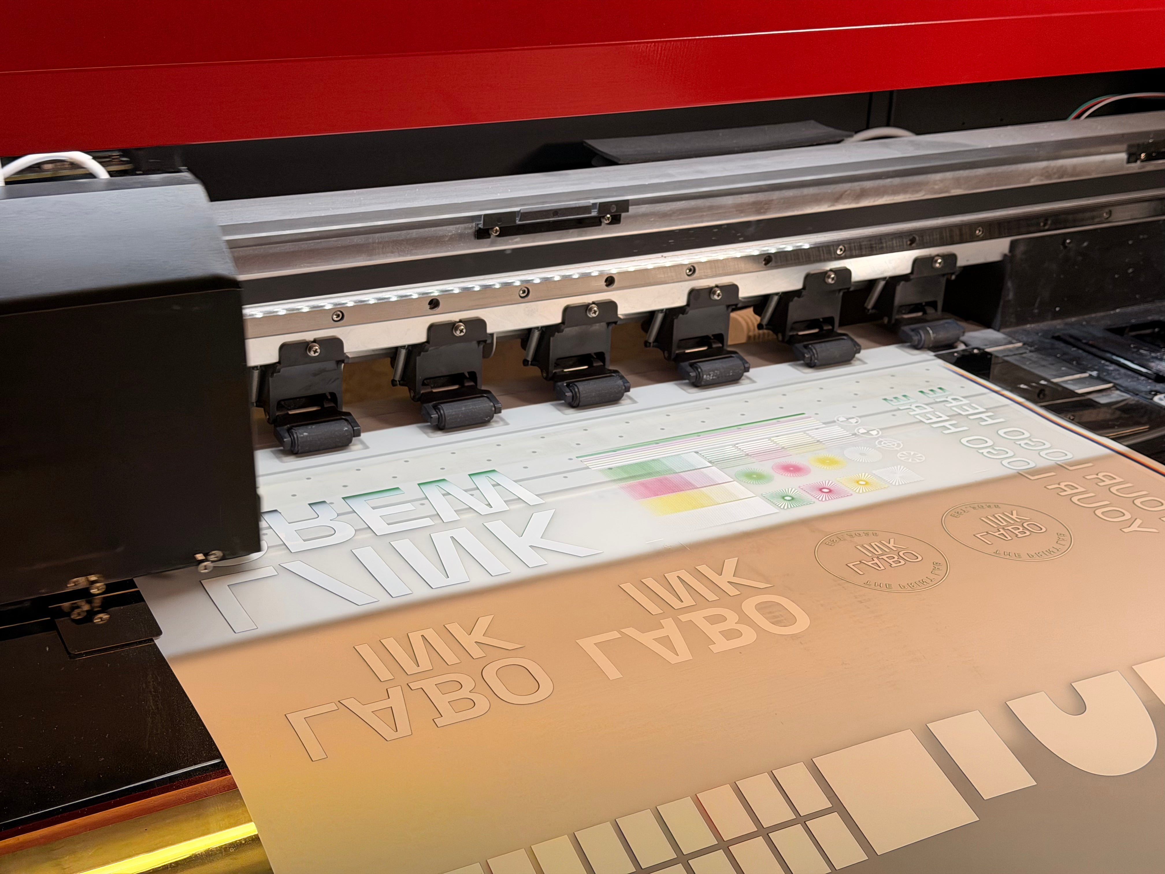 Close-up of a printing process with text and graphics on DTF Film.